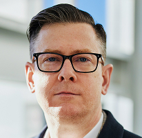 Alexander Hughes im CEO-Porträt als Führungskraft an der Spitze eines Krypto-Trading-Unternehmens